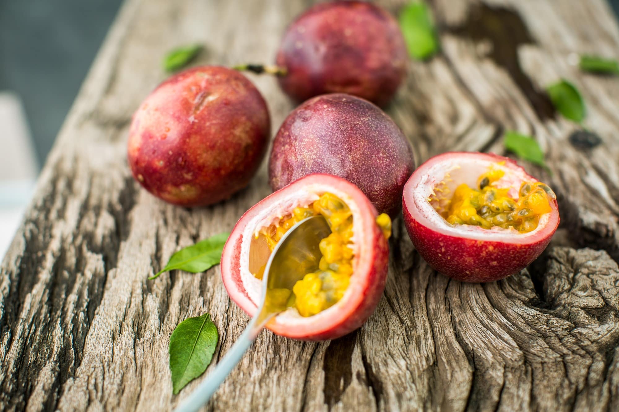 Passion fruit on a wooden board with knife